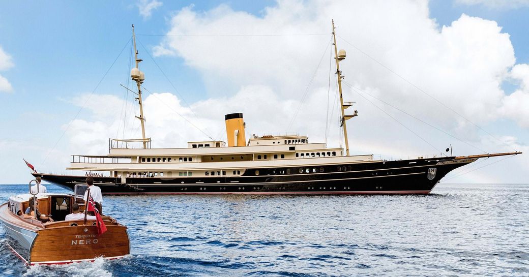 Charter yacht NERO at anchor with a tender in the foreground