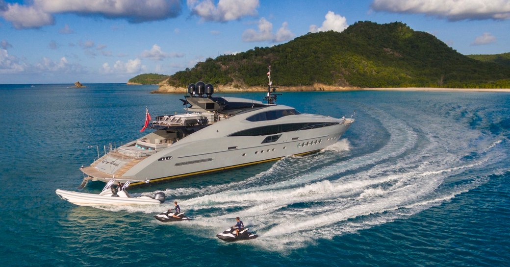 superyacht Grey Matters anchors as charter guests get out on jet skis and tender