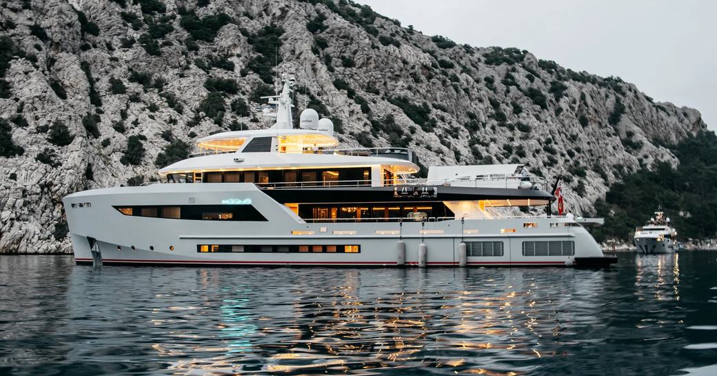 Charter yacht HEEUS side view at anchor