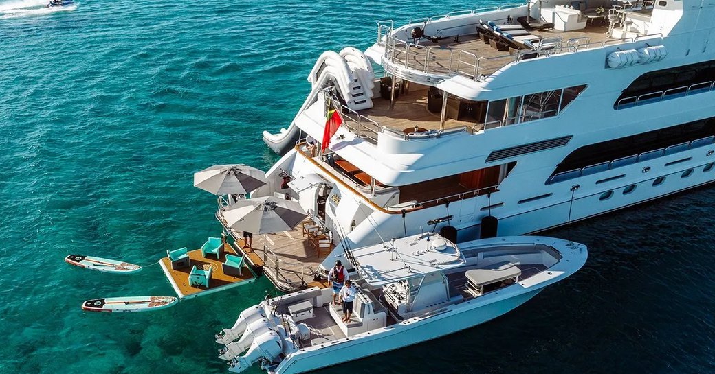Swim platform onboard superyacht charter REMEMBER WHEN with tender adjacent and water toys ready