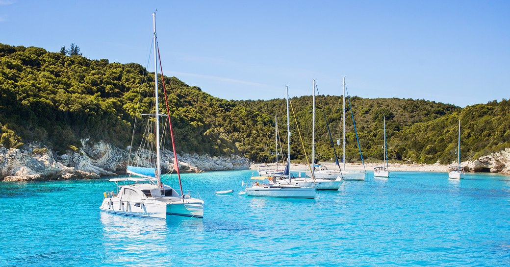 Beautiful bay with sailing boats and yacht charters near the Antipaxos island