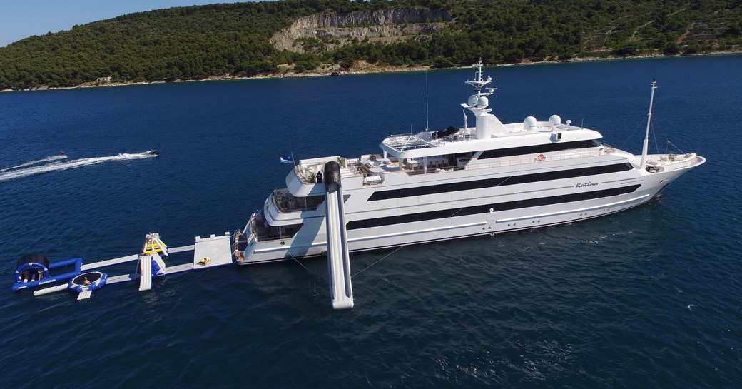 Superyacht KATINA on the water with toys out including slide