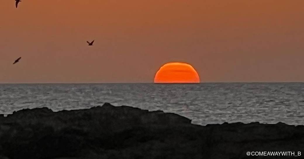 Orange sunset over the Daymaniyat rocks 