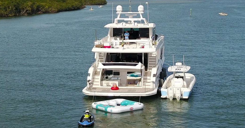 View of motor yacht Aqua Life from aft with beach club and toys visible