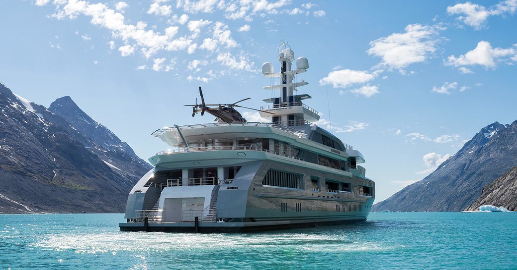 helicopter lands on helipad aboard expedition yacht CLOUDBREAK