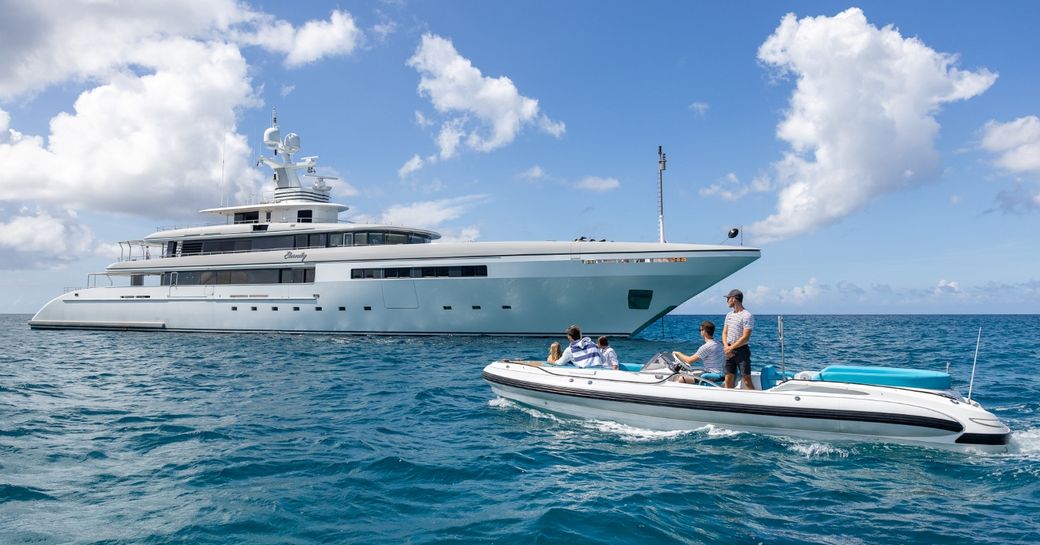 Charter yacht ETERNITY at sea with tender