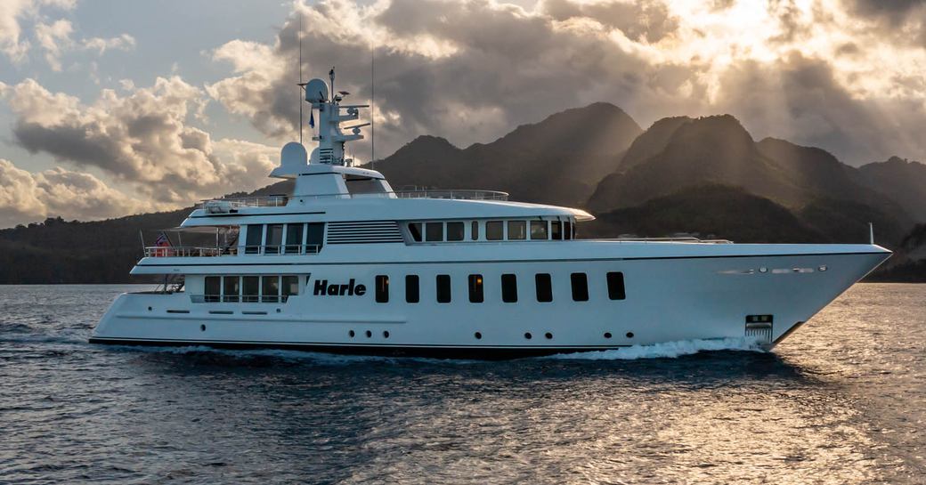 Charter yacht HARLE with mountains in the background