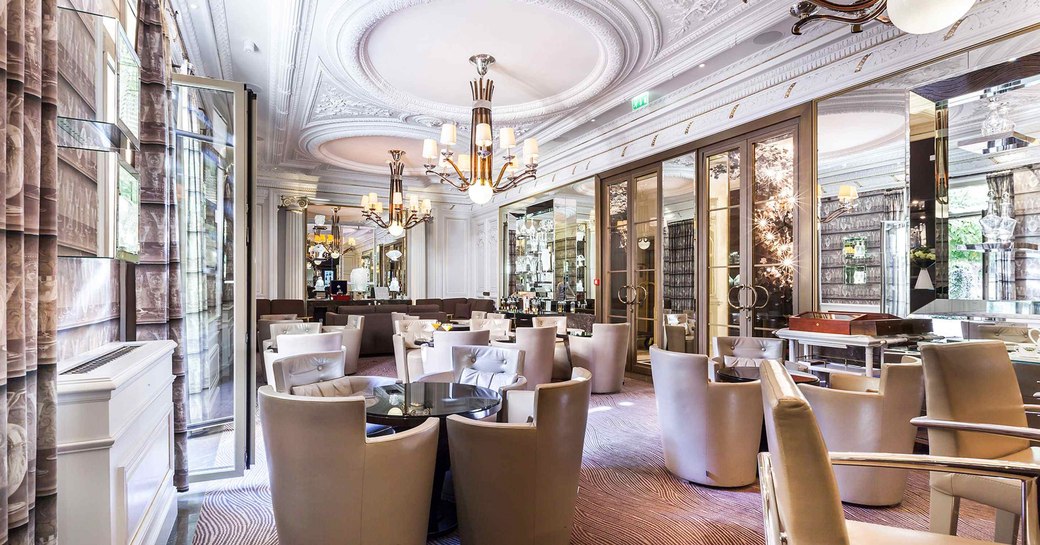 interiors of crystal bar in monaco, with chandeliers and plush seating