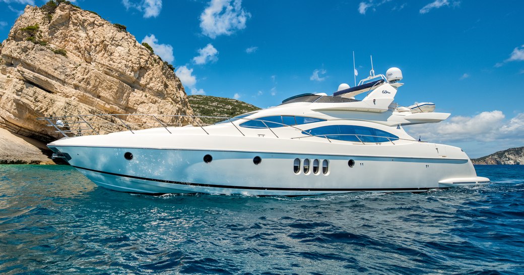 Charter yacht MANU at anchor in a bay