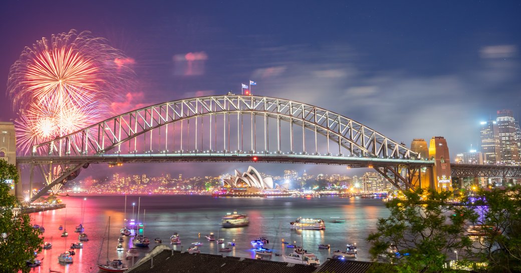 fireworks light up the sky in Sydney Harbour, Australia, for New Year's Eve