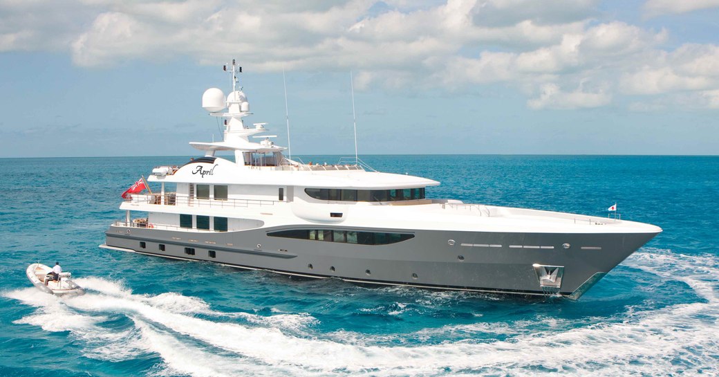 Superyacht LIND underway, being circled by tender, surrounded by sea