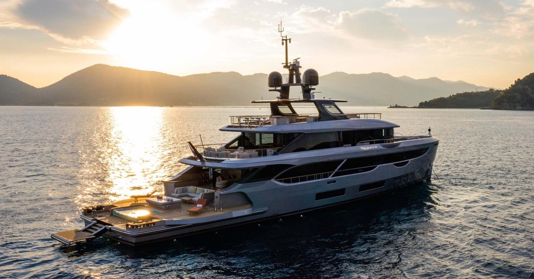 Benetti superyacht REBECA on water at sunset