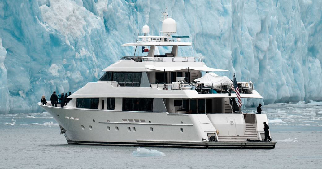 Luxury yacht next to glacier in Alaska