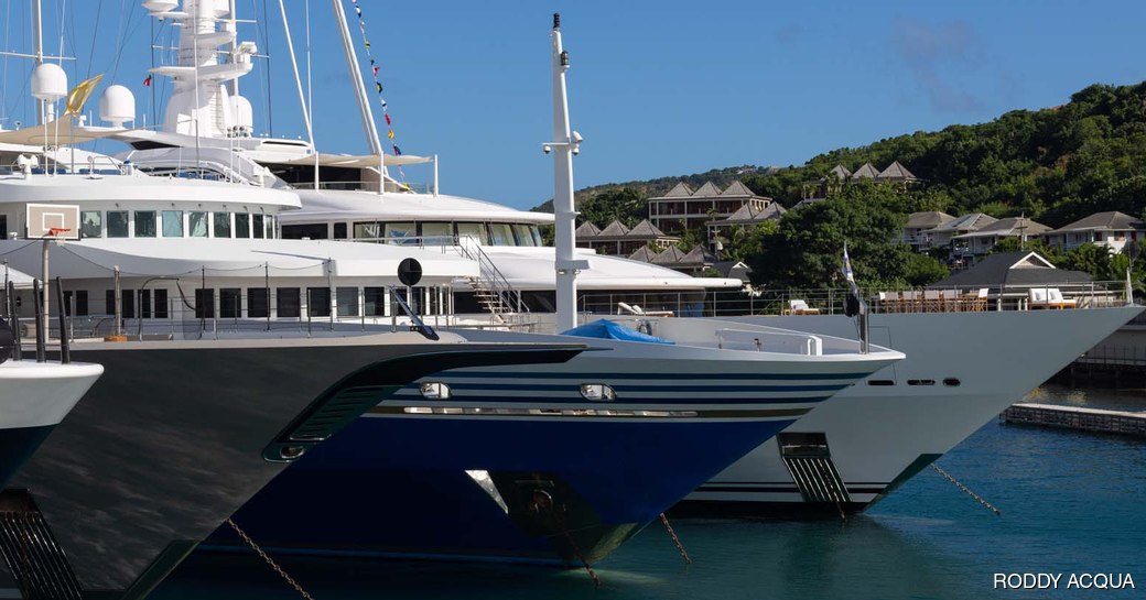 Line of superyacht bows 