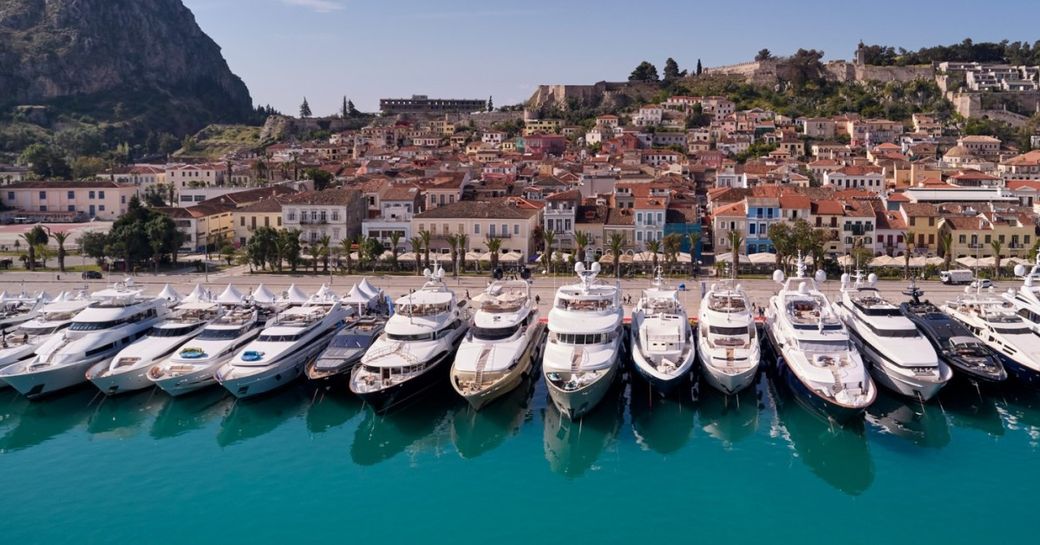 Line of charter yachts berthed at the Mediterranean Yacht Show