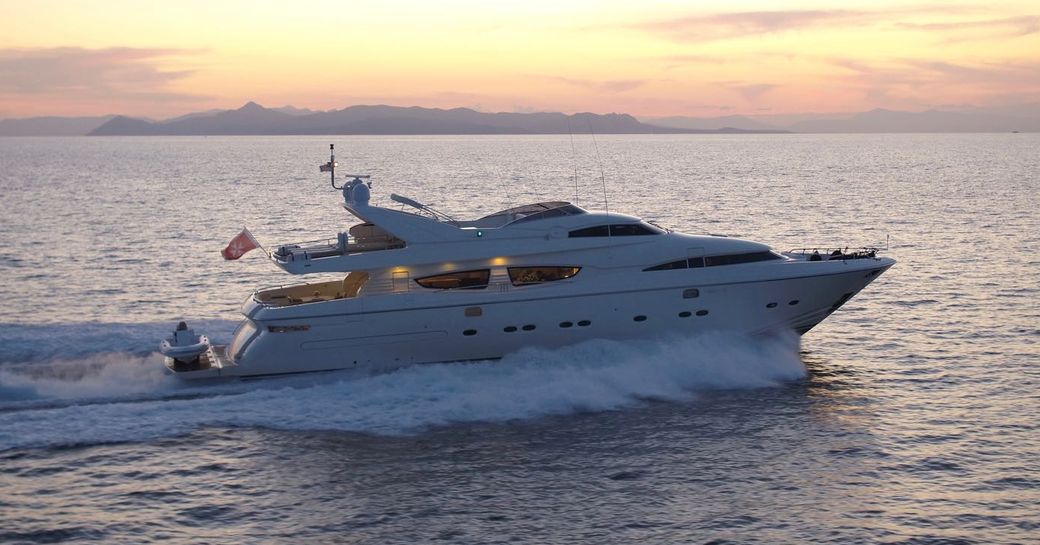 superyacht THEORIS cruising on a Greece yacht charter at dusk