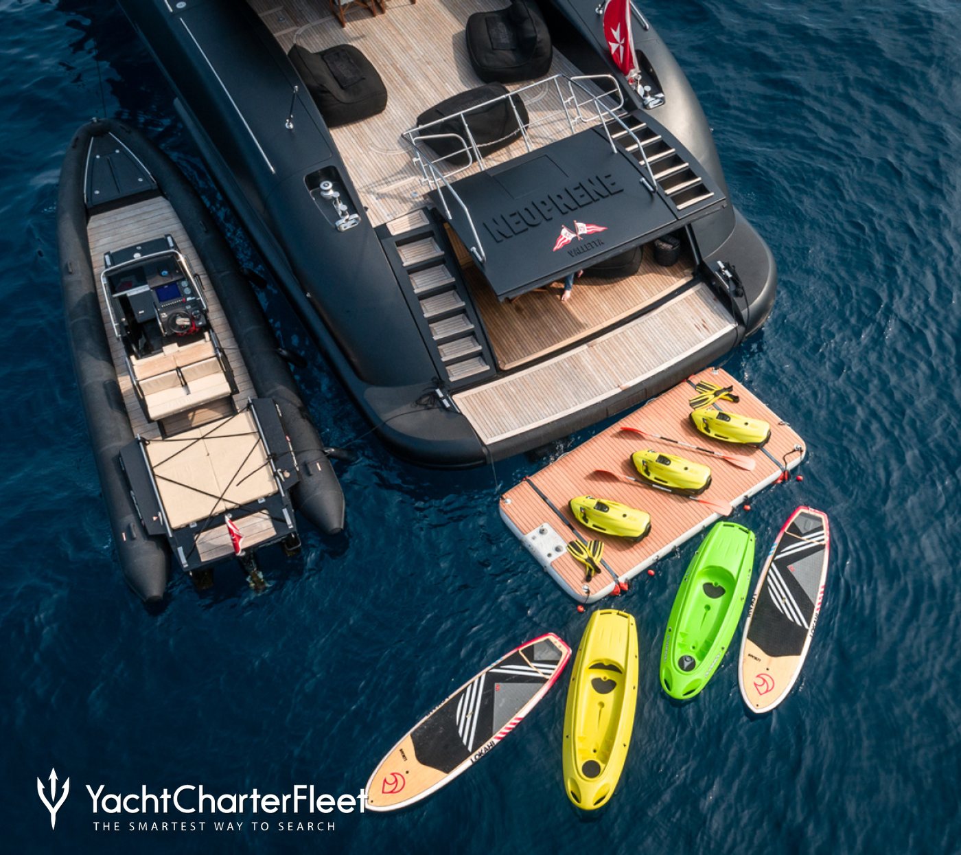 https://image.yachtcharterfleet.com/w1400/h1245/qh/ca/k29810430/cms/photo/1444753/aft-view-of-charter-yacht-neoprene-from-above-with-water-toys-behind.jpg