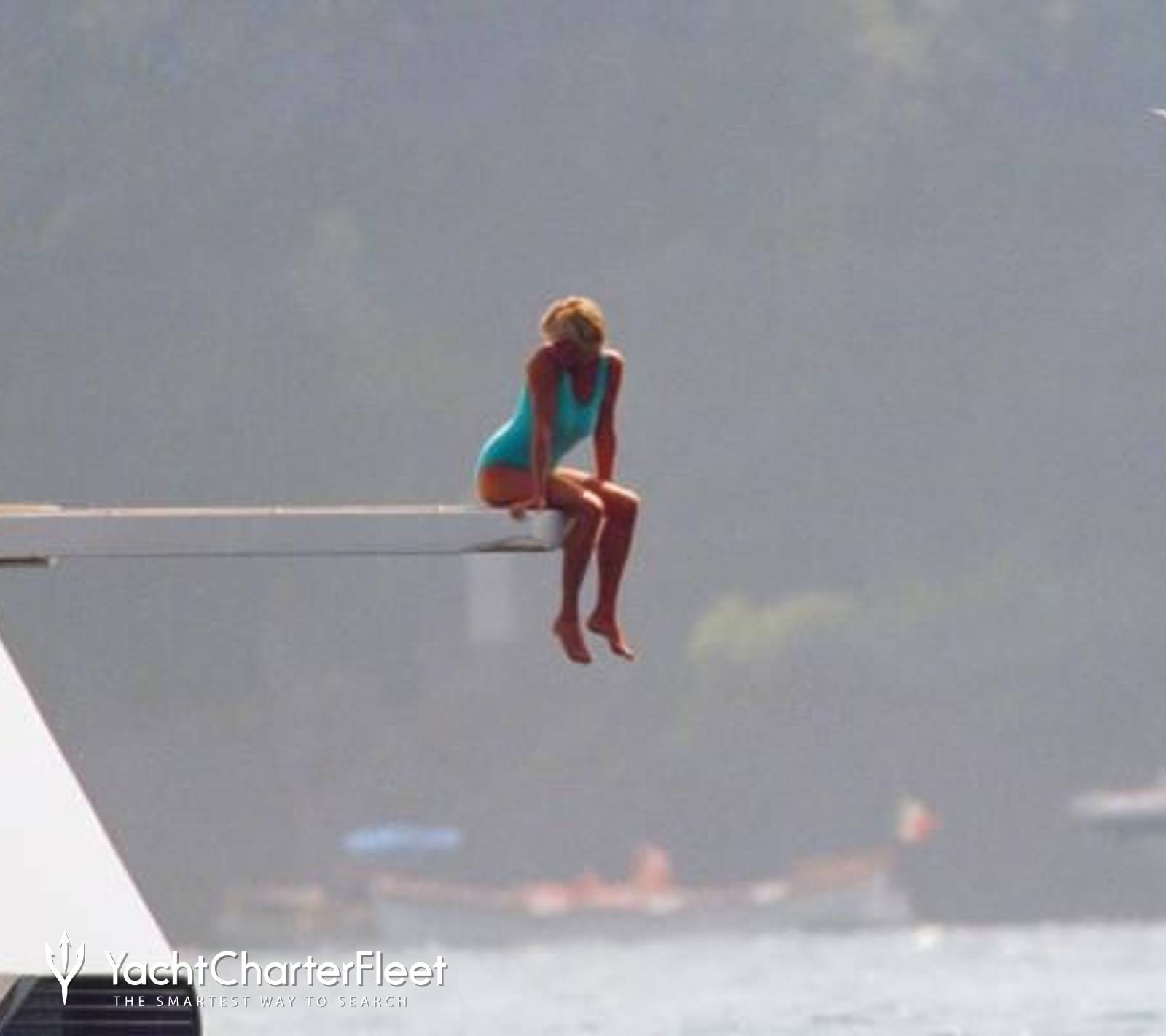 diana on yacht diving board