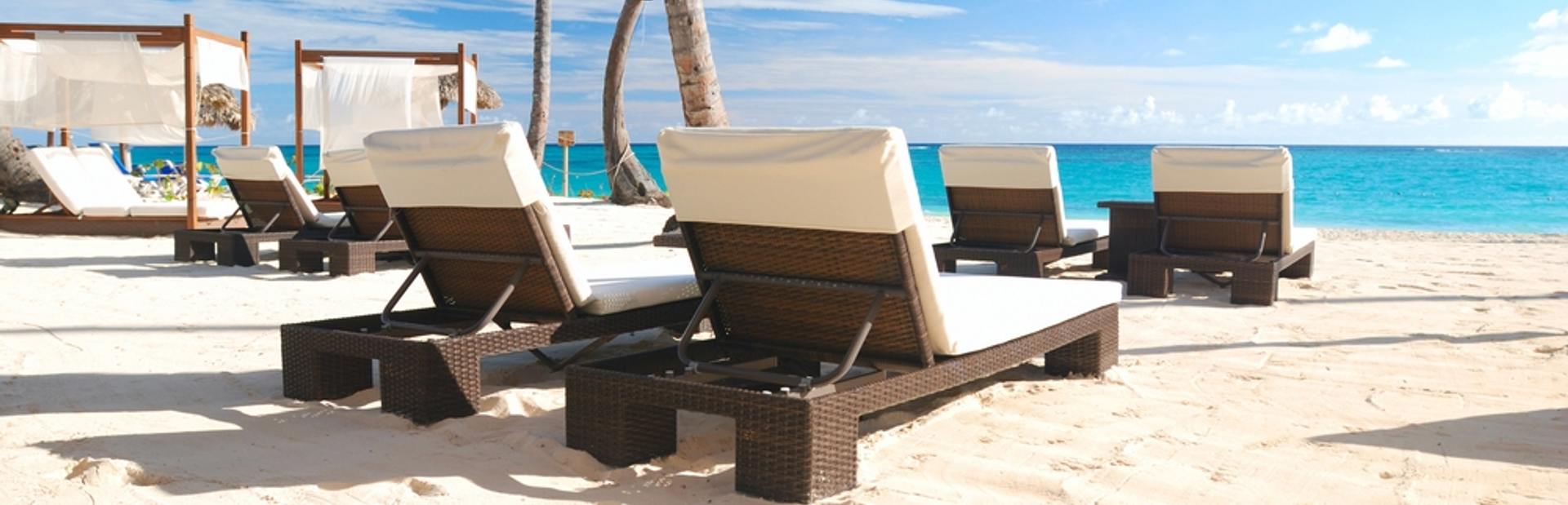 Luxurious wooden sunbeds on the beach