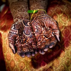 Indian bride presenting her henna tattoos