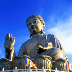 Statua of Buddha sitting cross-legged 