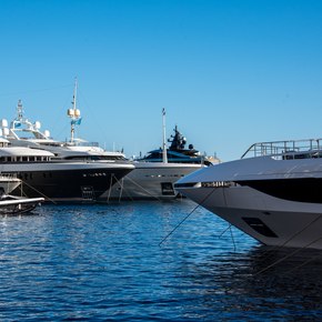 Array of superyachts berthed in Port Hercule during the Monaco Yacht Show