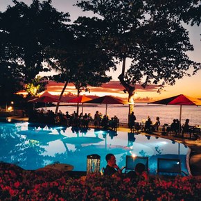 Tahiti - Tahiti Pearl Beach Resort pool dining area sunset