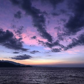 Purple-colored sunset over Batanta's seascape 