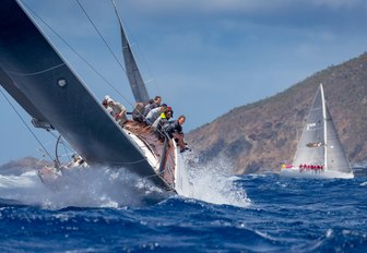 yacht cuts through the water during Les Voiles de Saint Barth 2018