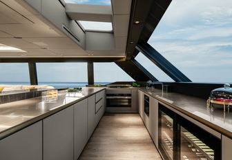 the galley in the main deck of motor yacht OTOCTONE 80 that has a modern style 