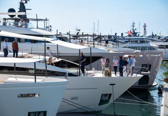 Visitors at Cannes Yachting Festival on superyacht bows