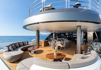 Solo seating area on upper deck, with soft seating and shaded alfresco dining 