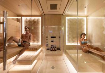 Superyacht charter SYMMETRY charter guests using steam room and sauna