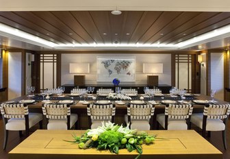 formal dining area with a large table in the main salon of luxury yacht Mary-Jean II 