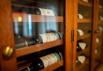 close up of wine bottles in the dedicated cellar aboard luxury yacht GRACE 