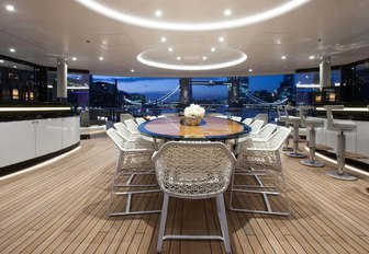 semi-alfresco dining area alongside bar on the upper deck aft of charter yacht KISMET 