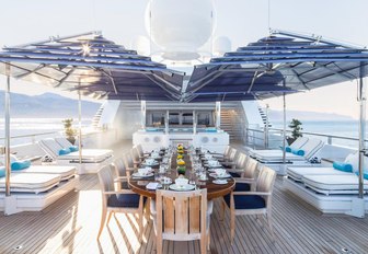 beautiful alfresco dining area on upper deck of luxury yacht TITANIA 