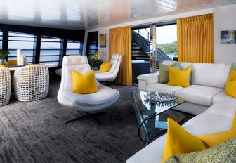 L-shaped sofa and arm chairs in the skylounge aboard charter yacht ‘Ocean Emerald’ 