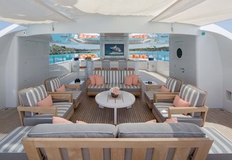 superyacht sundeck, with lounging area and tv screens