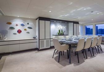 formal dining table in the main salon of luxury yacht Big Sky 