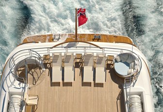 aeiral view of the sundeck aft with chaise loungers aboard Lurssen charter yacht HUNTRESS