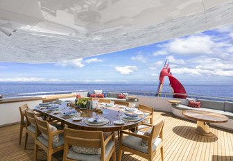 table on the aft deck of charter BROADWATER set up for dinner