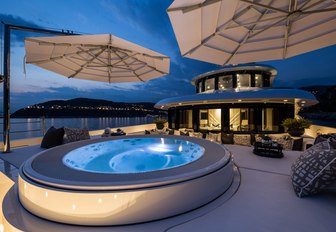 Jacuzzi and sunpads on the master suite terrace aboard motor yacht 11/11 