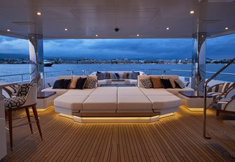 plush seating in luxury superyacht JOYin the evening illuminated by custom LED lights