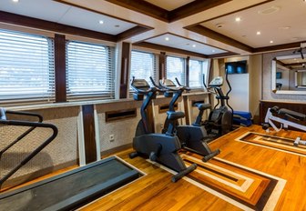 A collection of exercise equipment inside a superyacht gymnasium