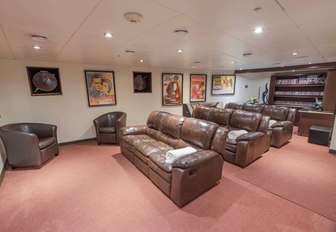 movie theater with plush reclining sofas on board luxury yacht GLOBAL 