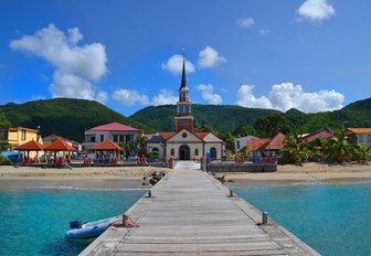 a quiet and colourful coastal settlement in the Caribbean as part of luxury yacht charter itinerary 