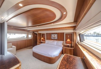 warm woods and large windows in master suite aboard motor yacht Antonia II 