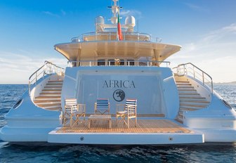 table and chairs on the swim platform of luxury yacht Africa I