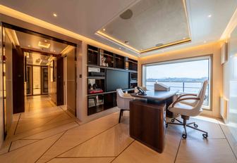 Charter yacht SYMMETRY private office with desk and large window